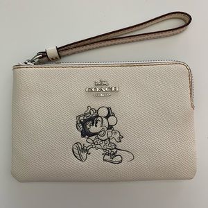 Coach Disney wristlet with Minnie Mouse motif